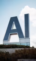 a large blue sign sitting on top of a building