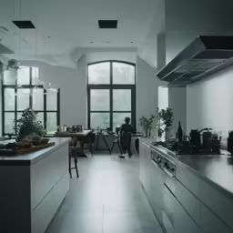 a kitchen with a large window and an open stove