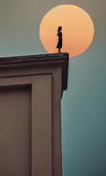 a person standing on top of a building next to the sun