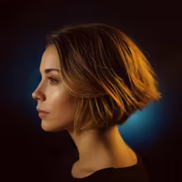 a beautiful young woman with a side part swept back