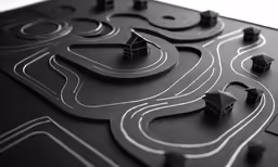 a model of houses, roads and the surrounding streets