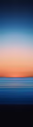 the horizon is visible over blue water at sunset