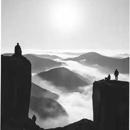 a person standing on a mountain ledge with his back to the camera