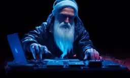 the old man is using his laptop while glowing