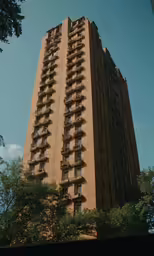 the top of an apartment building looks very tall
