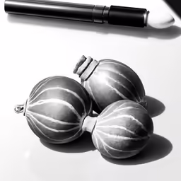 three christmas baubles, one is black and white