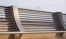 two lines of metal support are placed on a bench
