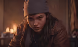 a close up of a person with long hair and a leather jacket