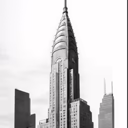 the chrysler building towering over other tall buildings