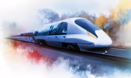 a silver and black train is going down the tracks