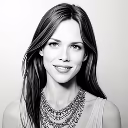 the woman is wearing a necklace that has silver beads on it