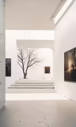 a painting hangs in the center of the room