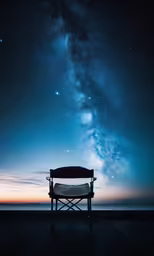 a bench sits beneath a large star filled sky