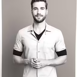 a male model dressed in white with a black shirt