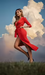 a woman is in red poses for a photograph