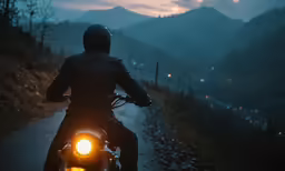 a person is riding a motorcycle down the street
