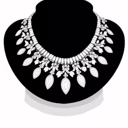 a silver necklace with white beads on a black stand,a jewelry set with jewels in the form of a flower,a black and white necklace on display on a black mannequin,a jewelry set made with various white beads and leaves,an image of a white necklace on a black head stand