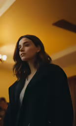 the woman is looking off into the distance