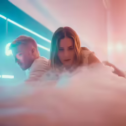 two people in a cloud filled room