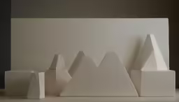 the sculpture of pyramids and mountain peaks by paul moore