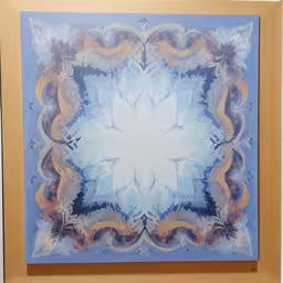 this is an oil painting of a light blue and yellow abstract design,painting in a frame with a flower pattern