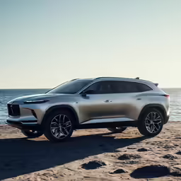 the 2020 infinroad suv is parked on a beach near the water