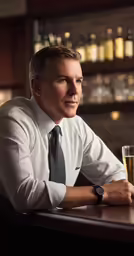 a man in white shirt and black tie holding up a glass of beer