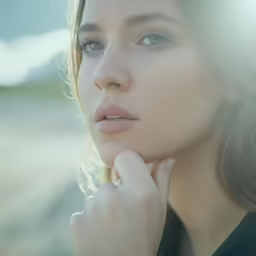 the young woman has blue eyes and brown hair
