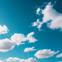 there is blue and white sky with some white clouds