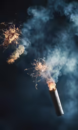 an ashpipe lit up by bright smoke against a dark blue sky