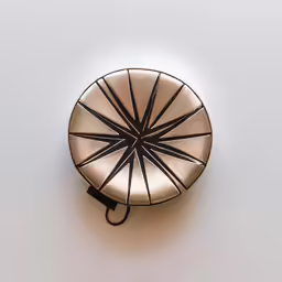 a lamp on top of a white wall