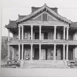 a large house with multiple porches and columns