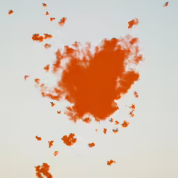 an image of a red smoke cloud with a blue sky behind it