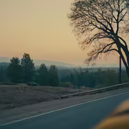 an empty road is pictured in the evening