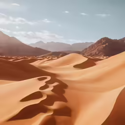 a wide view of mountains from the sand