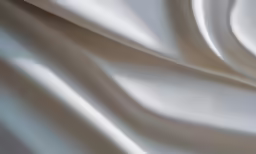 white satin fabric close up with smooth folds