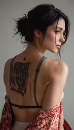 there is a woman with tattoos on her back
