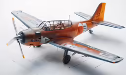 a small, rusty airplane is parked in the snow