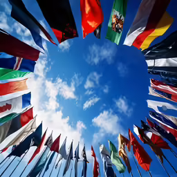 a bunch of colorful flags sitting in the air