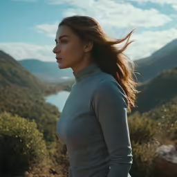 there is a woman with long hair in the mountains