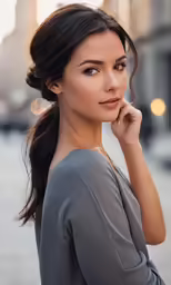 the woman is posing for a photo on the street