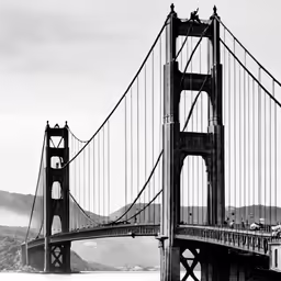 a tall bridge with a lot of traffic coming down it
