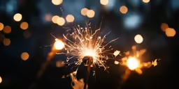 a sparkling sparkler sitting on top of a wooden stick