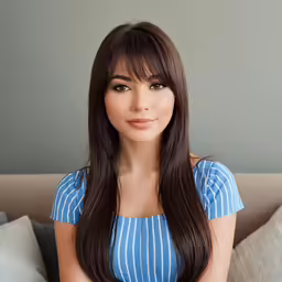 a woman posing for the camera with long brown hair