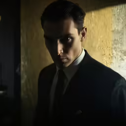 a person that is dressed in a suit