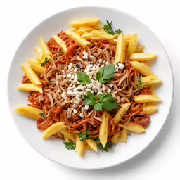 the pasta dish has noodles, tomatoes and green vegetables