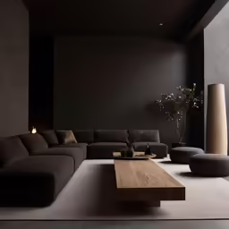 a large brown couch sitting next to a tall table