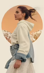 a girl in a sweatshirt and skirt with a desert view as a background
