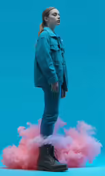 a woman standing on a cloud of pink smoke