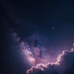 a couple of clouds and the stars in the sky